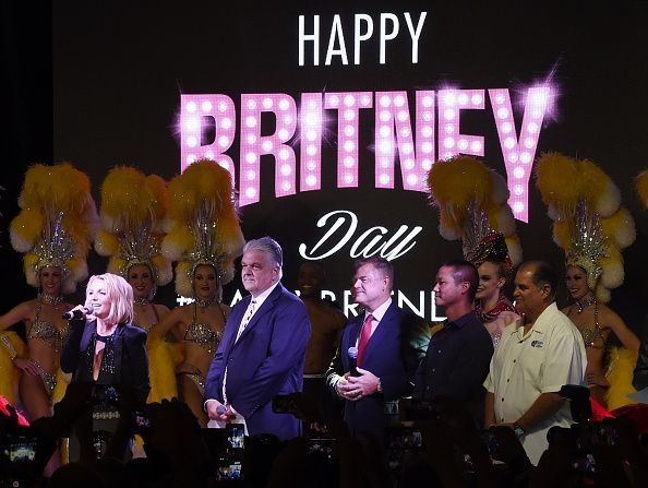 People on stage celebrating 