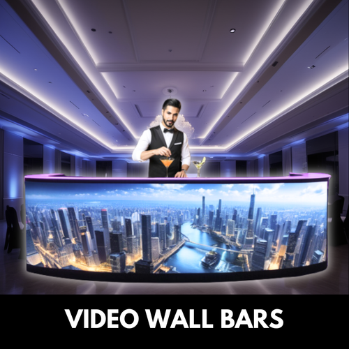 Bartender at a curved video wall bar displaying a cityscape, in a modern venue with blue and purple lighting.