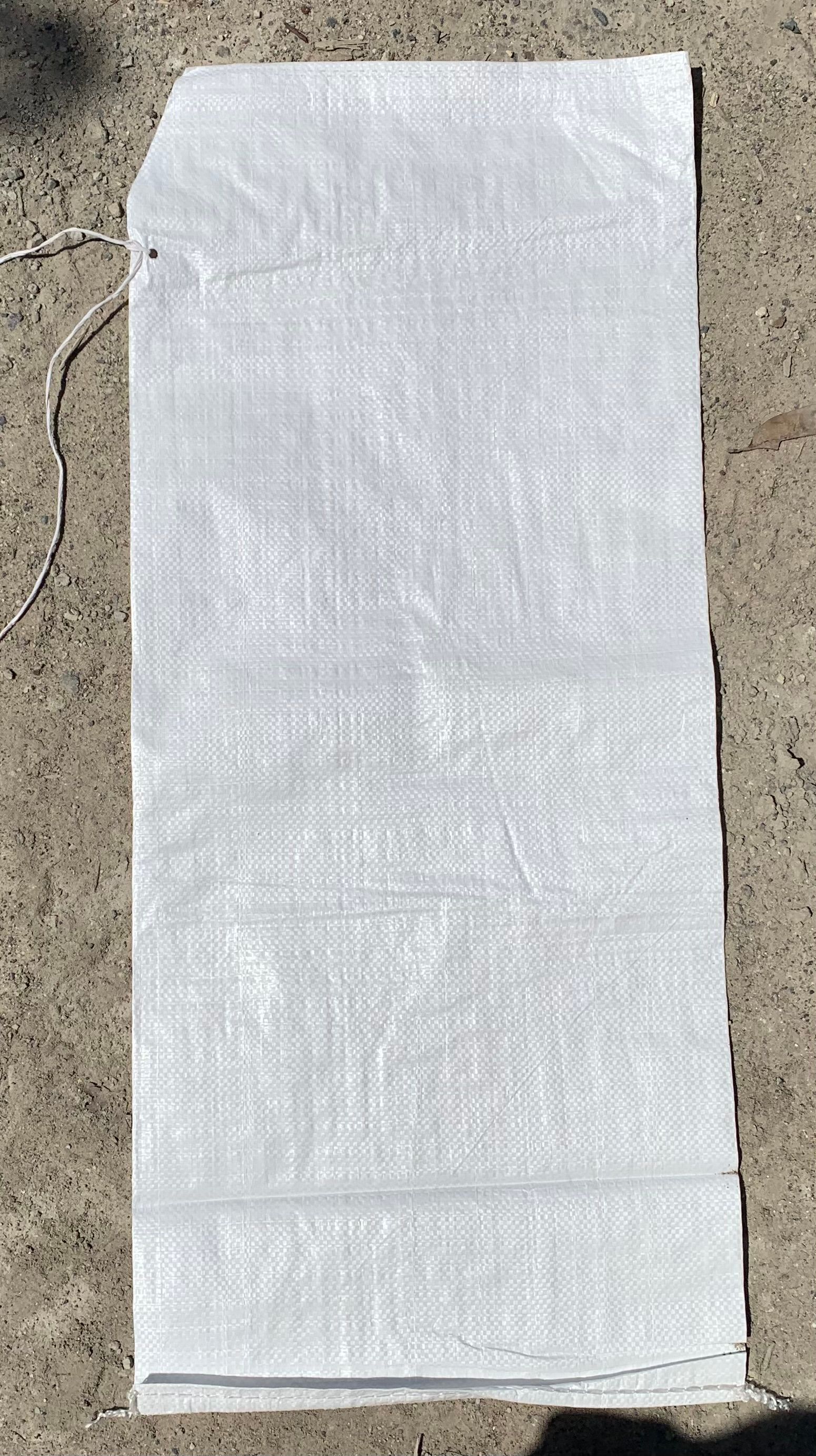 A Pile Of Sandbags Stacked On Top Of Each Other On A Beach — Serious About Landscape Supplies In West Gosford, NSW