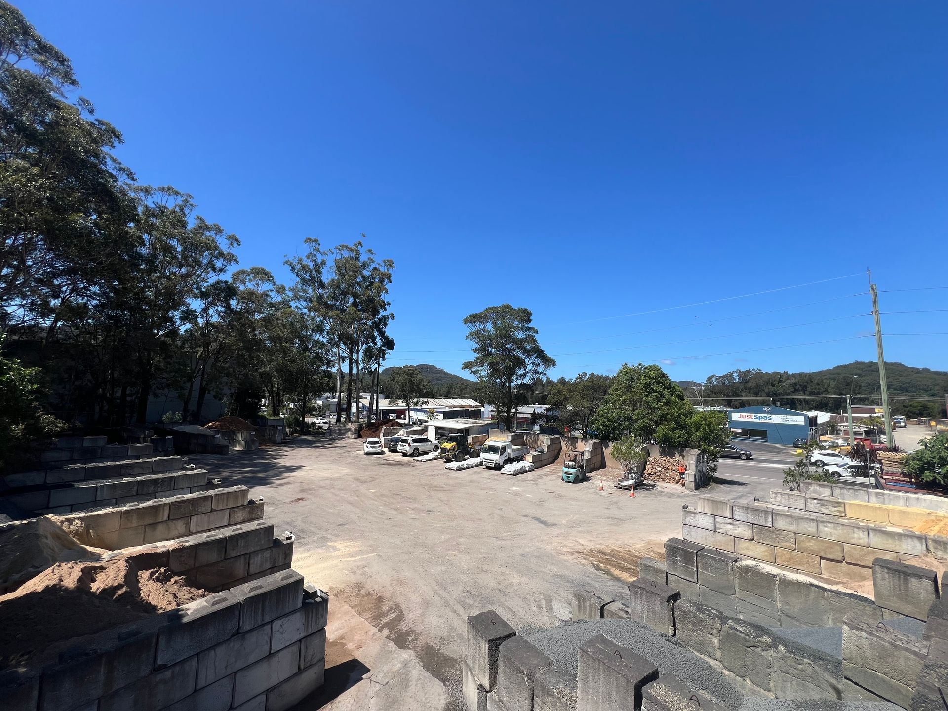 An Aerial View Of A Construction Site With A Yellow Tractor — Serious About Landscape Supplies In West Gosford, NSW