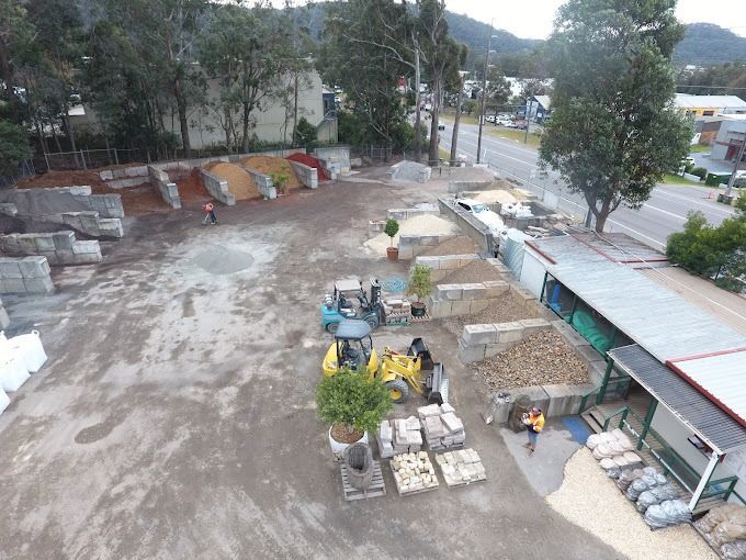 An Aerial View Of A Construction Site With A Yellow Tractor — Serious About Landscape Supplies In West Gosford, NSW