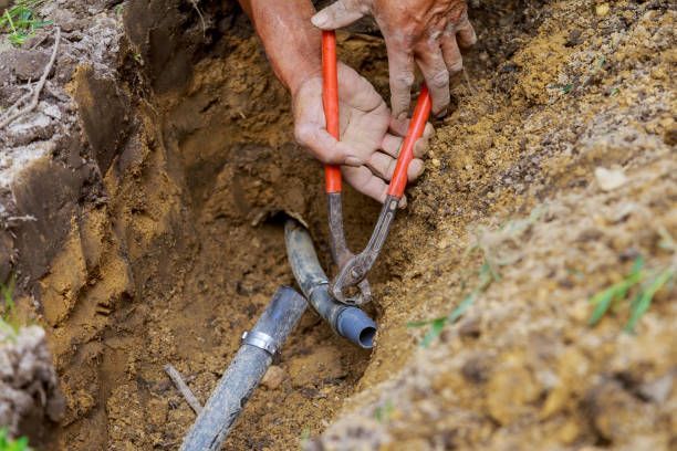 A worker from Michael Poremski & Son Plumbing & Heating, Inc. is performing a water line installation in Pittsburgh, PA.