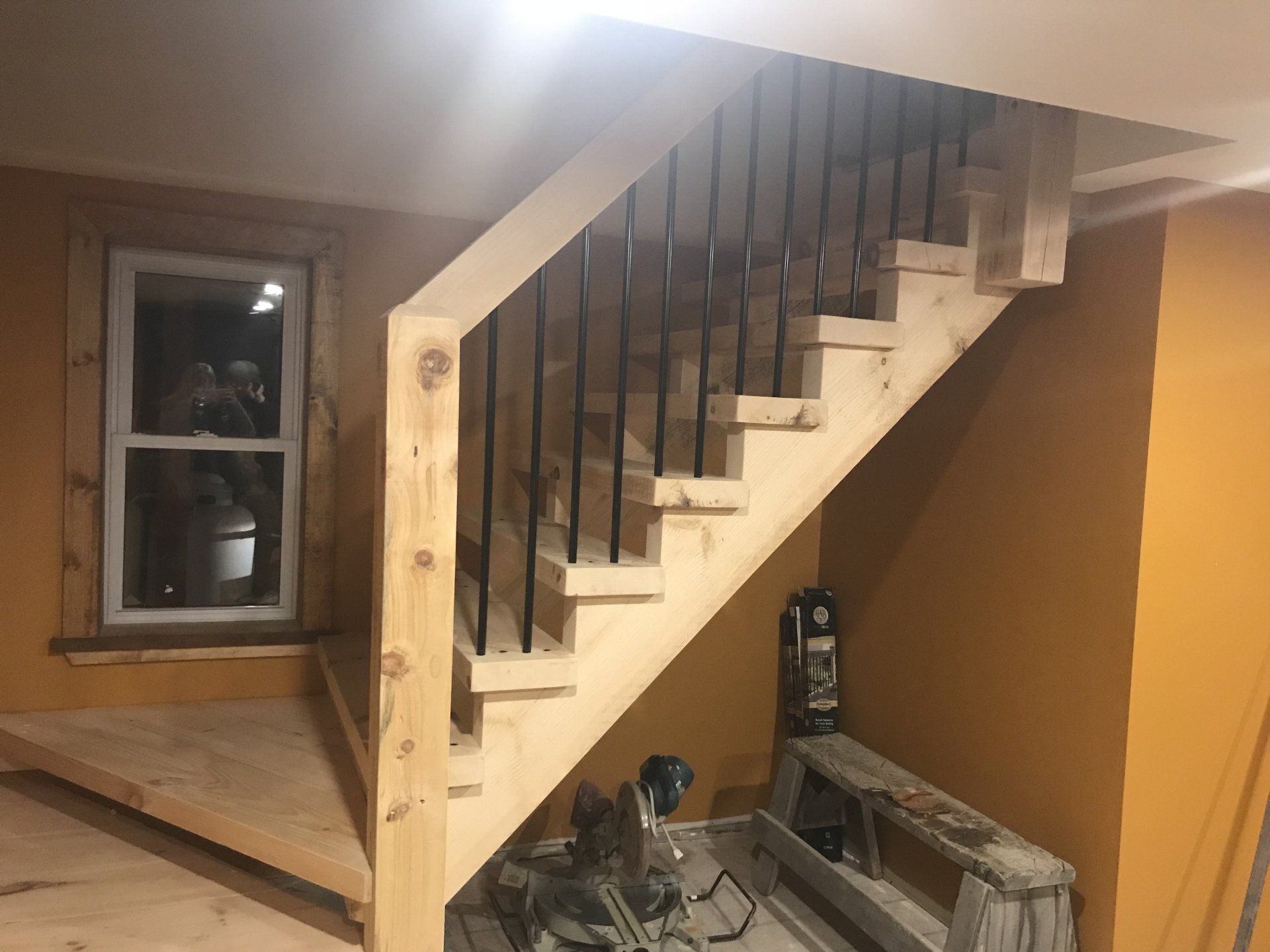 partially stained timber staircase