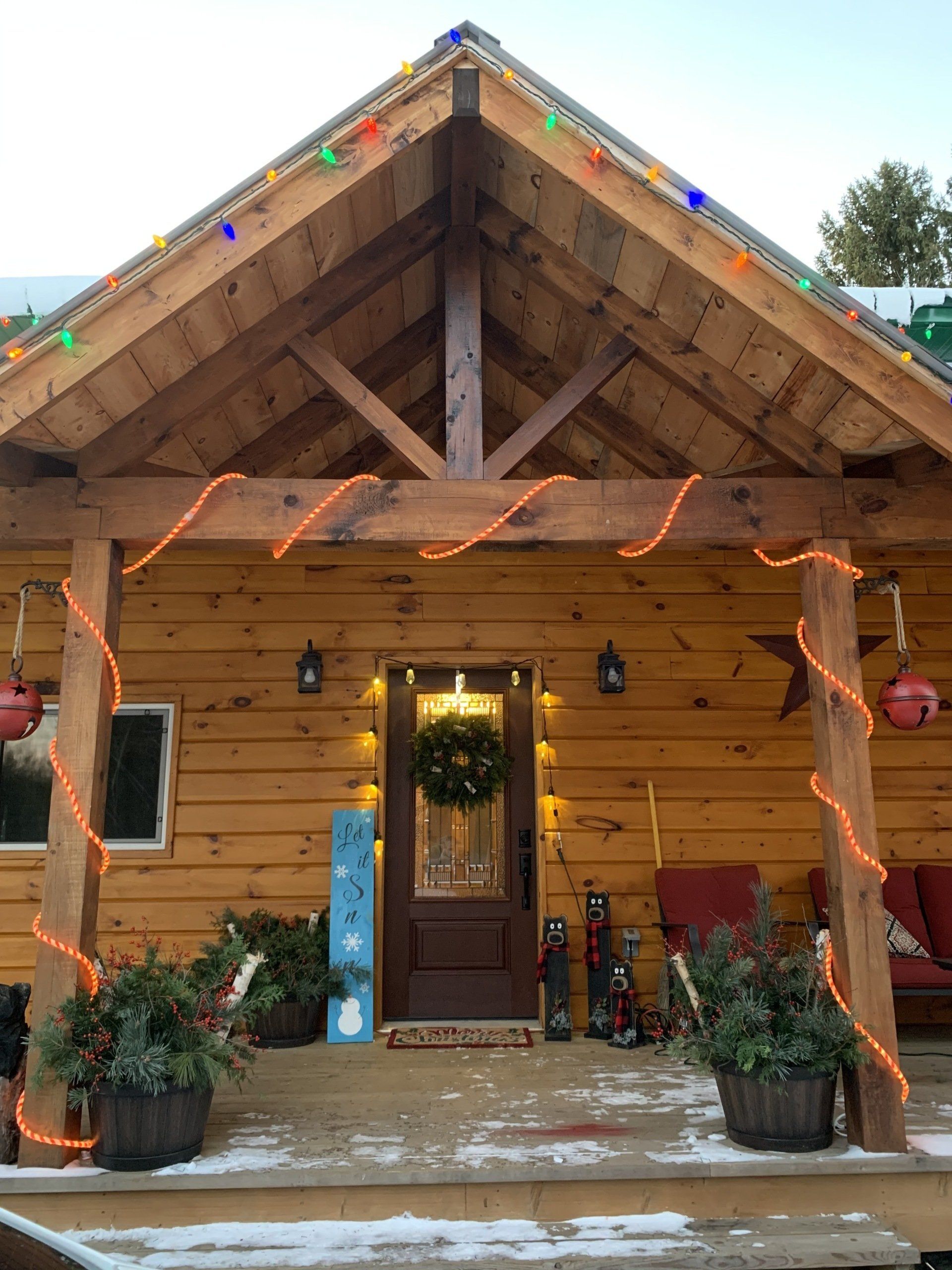 front porch of large wooden cottage