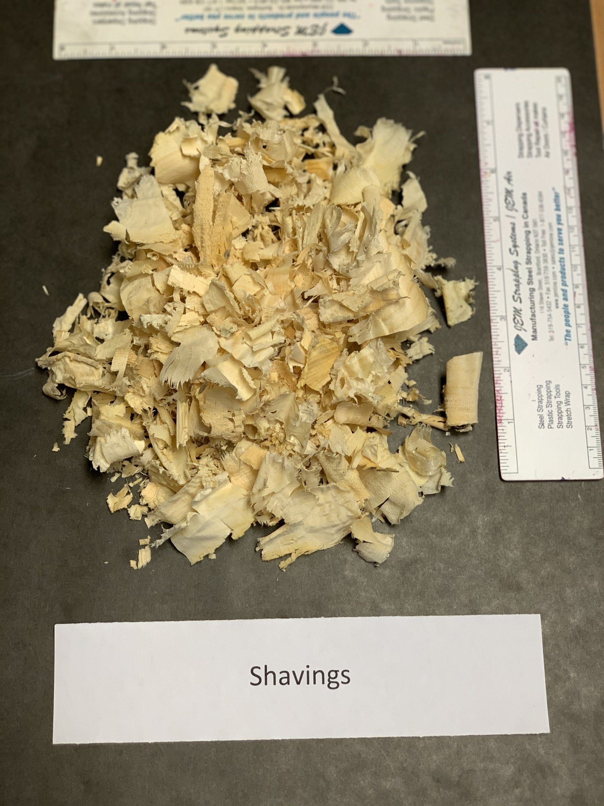 wood shavings and chips on black background