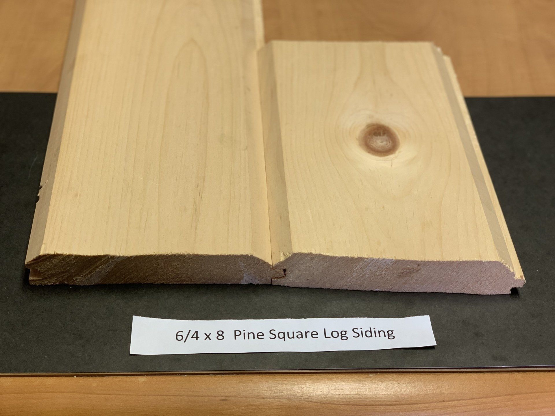 close up of beige square pine wood sidings