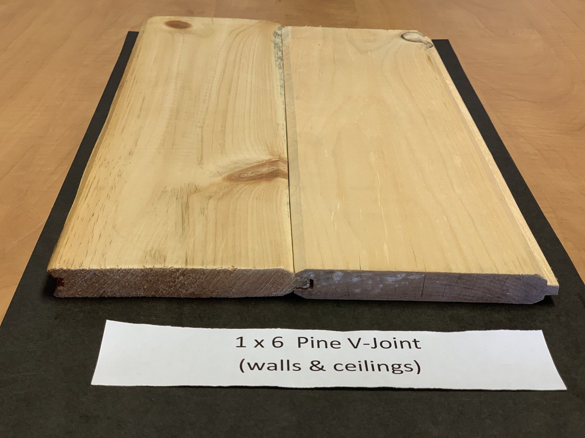 close up of thin beige pine wood siding slabs