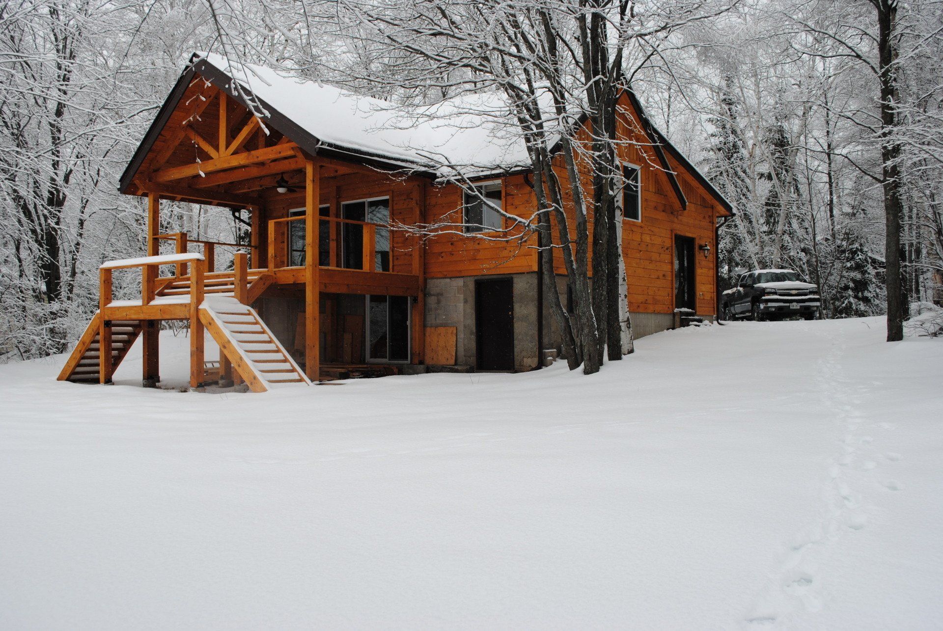 wood cottage in the snow