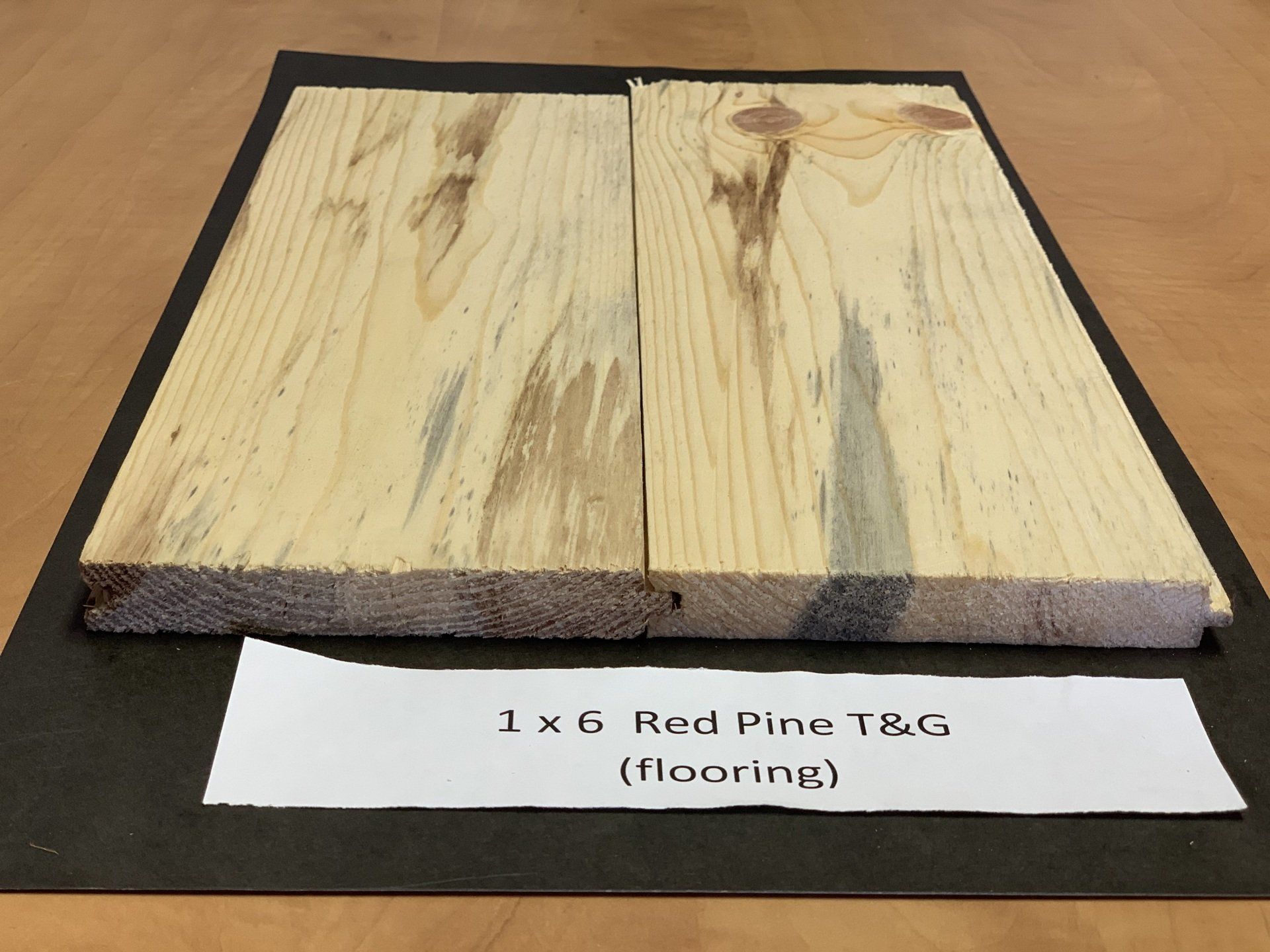 close up of long beige pine wood siding slabs for house