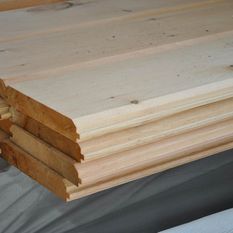 sheets of beige pine wood siding for house