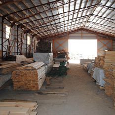 warehouse with multiple stacks of wood