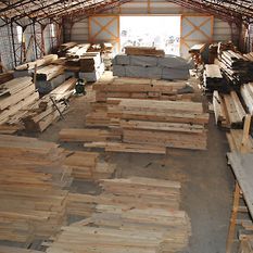 warehouse with piles of wood