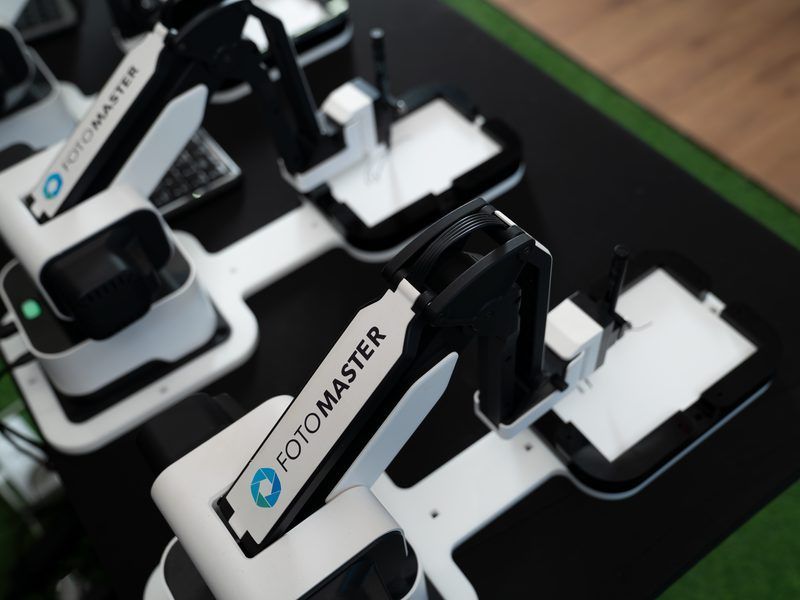 Two white and black robotic arms branded