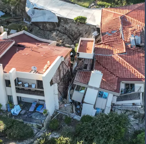 an aerial view of a house that has fallen into the ground