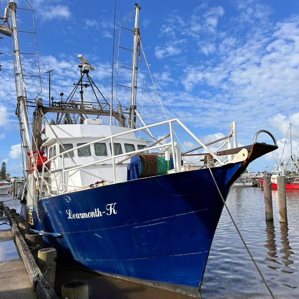 A Blue Boat With the Name Lonesmith on the Side — Noosa Junction Seafood Market in Noosa Heads, QLD