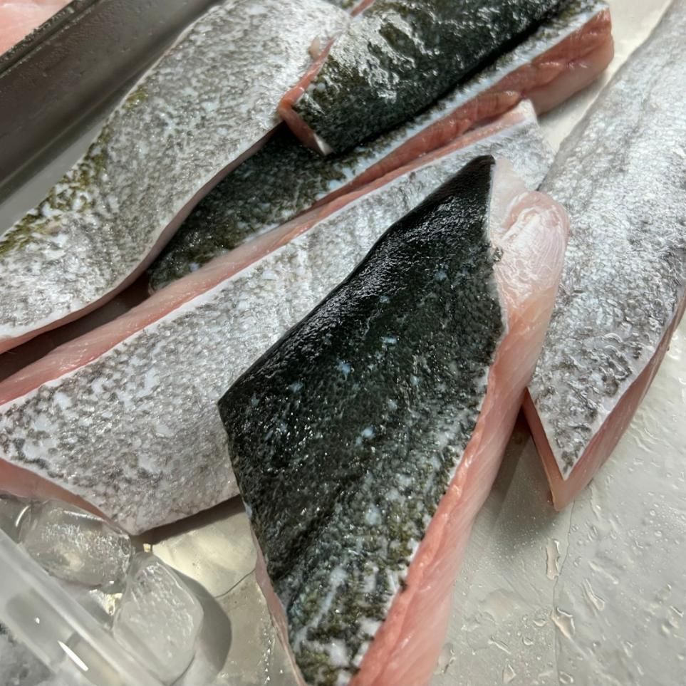 A Close Up of a Piece of Fish on a Table — Noosa Junction Seafood Market in Noosa Heads, QLD