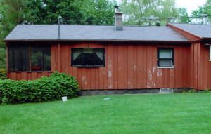 Before: a house with old worn out siding