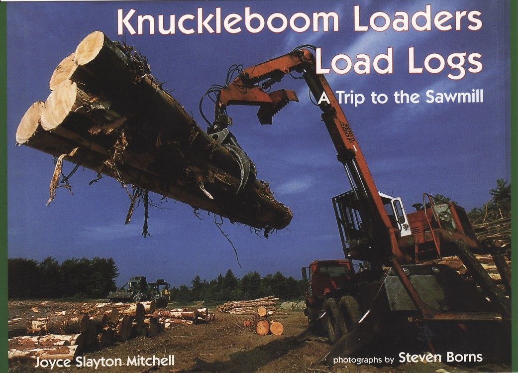 Knuckleboom loader lifting logs, readying them to be loaded at the sawmill.