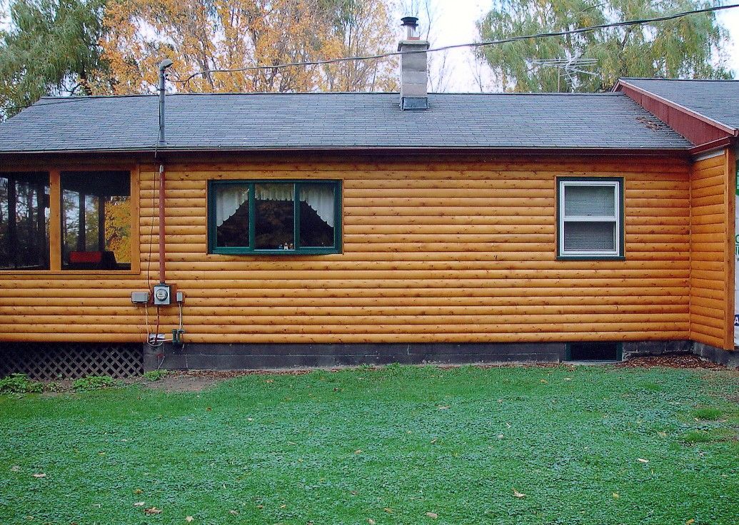 After: a house with new log siding