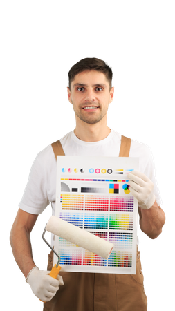 A man is holding a paint roller and a color chart.