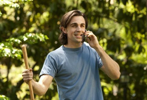 woodpecker tree services a person talking in mobile phone