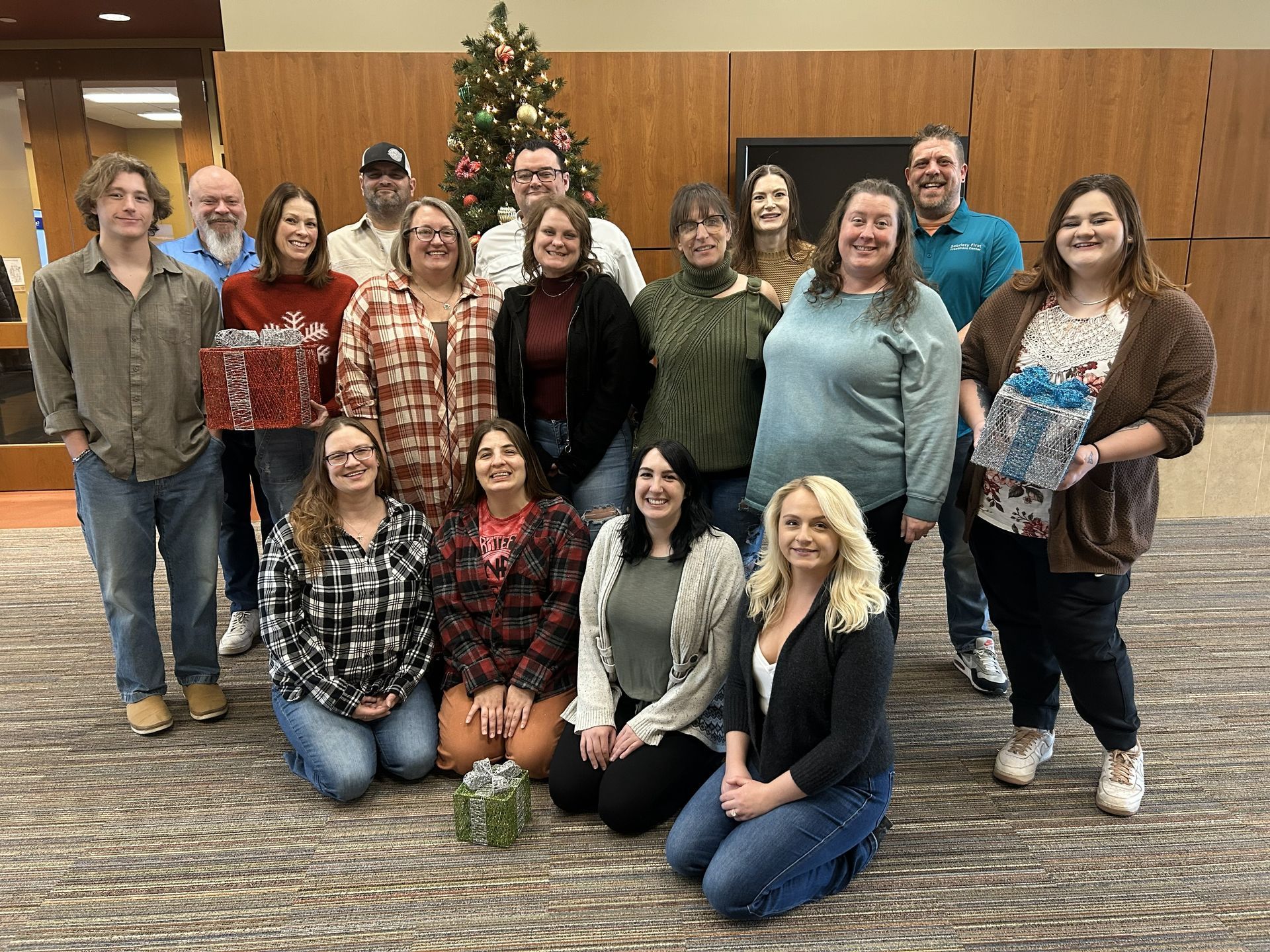 A group of people standing in front of a sobriety first drug rehabilitation center