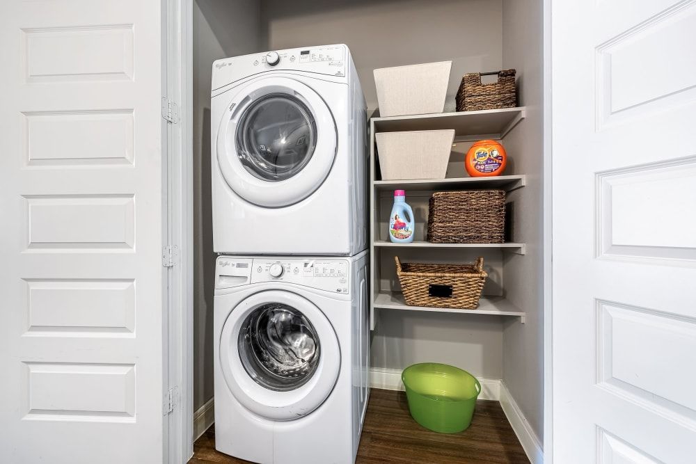 Laundry area with closet shelves at Marquis at Barton Trails in Austin, TX.