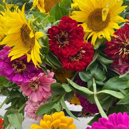 There are many different types of flowers in this bouquet.