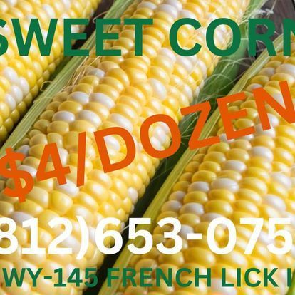 A sign that says sweet corn $ 4 / dozen wy-145 french lick