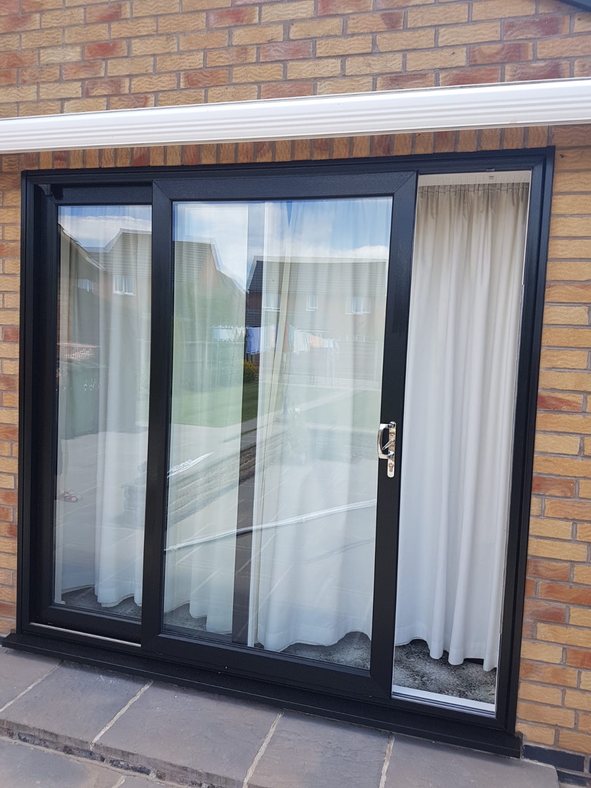 New patio doors-in black/brown UPVC in Ibstock