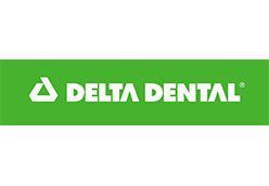 a green and white delta dental logo on a white background .