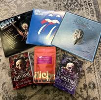 Vinyl records and Halloween-themed treats on a patterned surface.