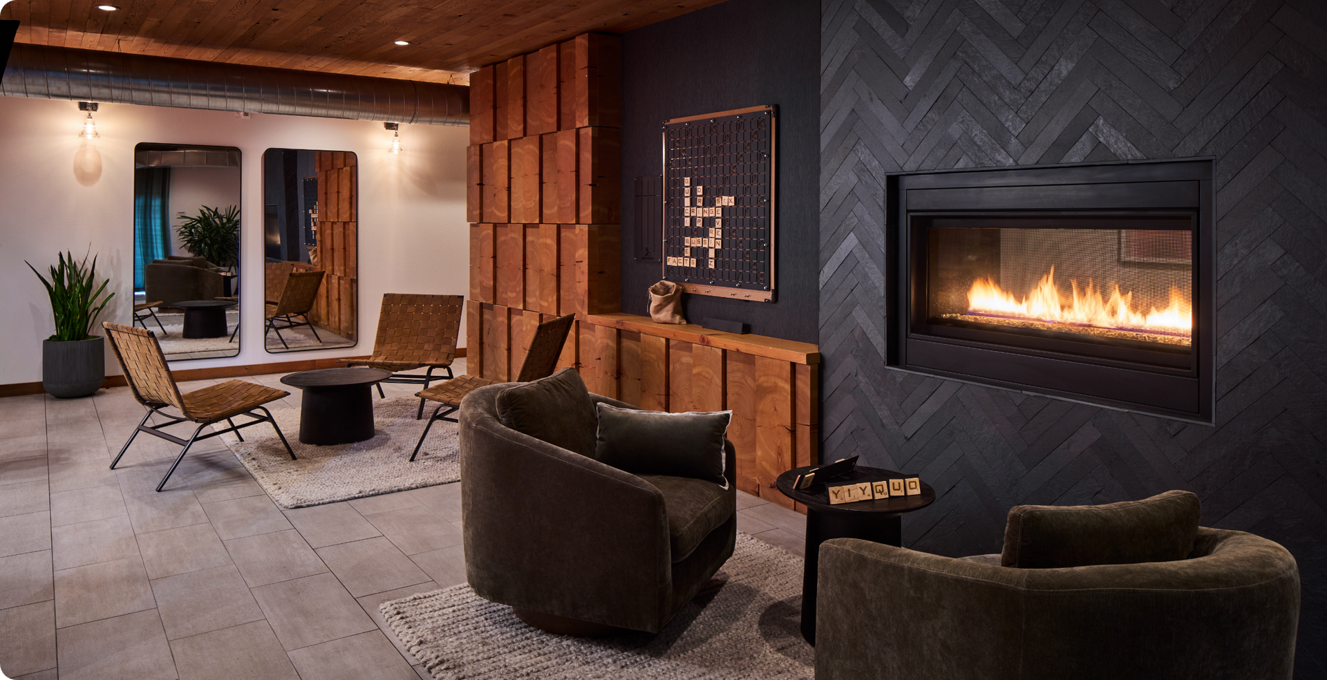 Dark lounge area with fireplace.