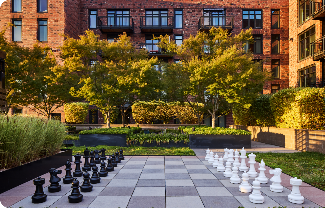 Building exterior shot of Goat House's large outdoor chess board.