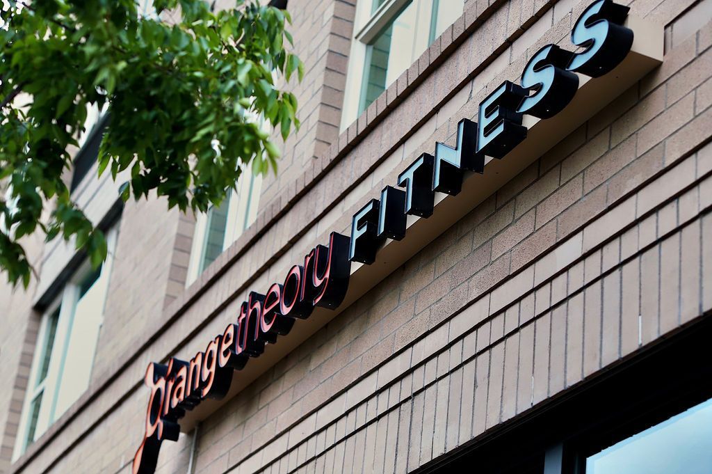One Way Fitness sign on a brick building exterior