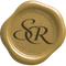 A gold-colored wax seal featuring the elegant, overlapping cursive letters