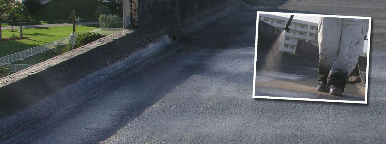 A picture of a person using a pressure washer on a road.