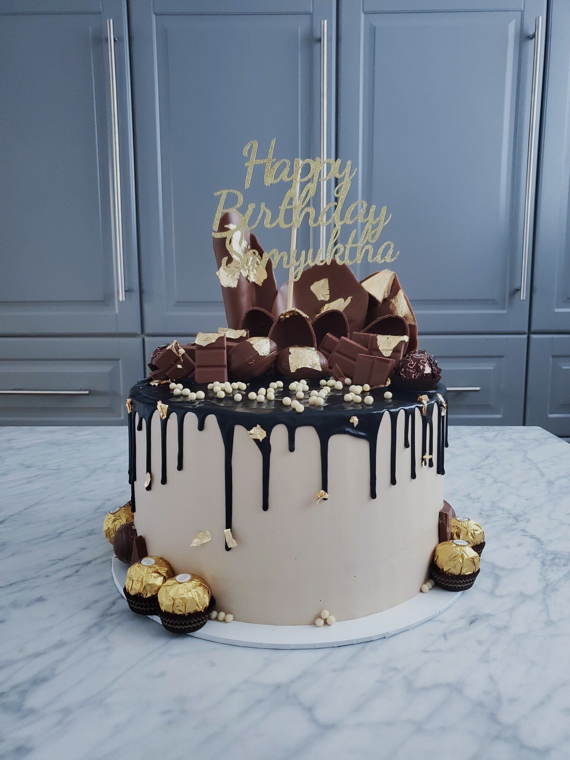 chocolate drip cake with chocolate pieces
