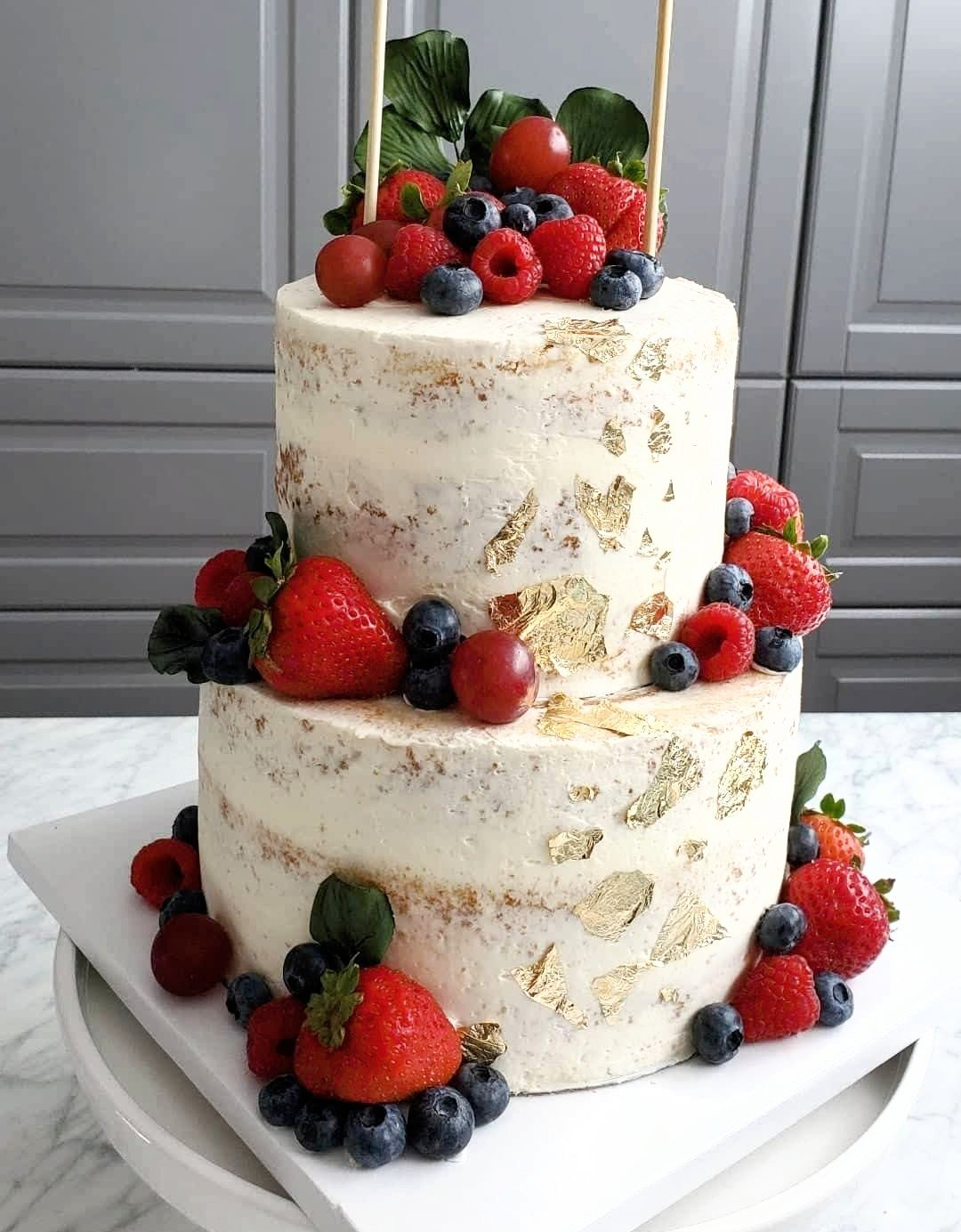 two tier white cake with fruit
