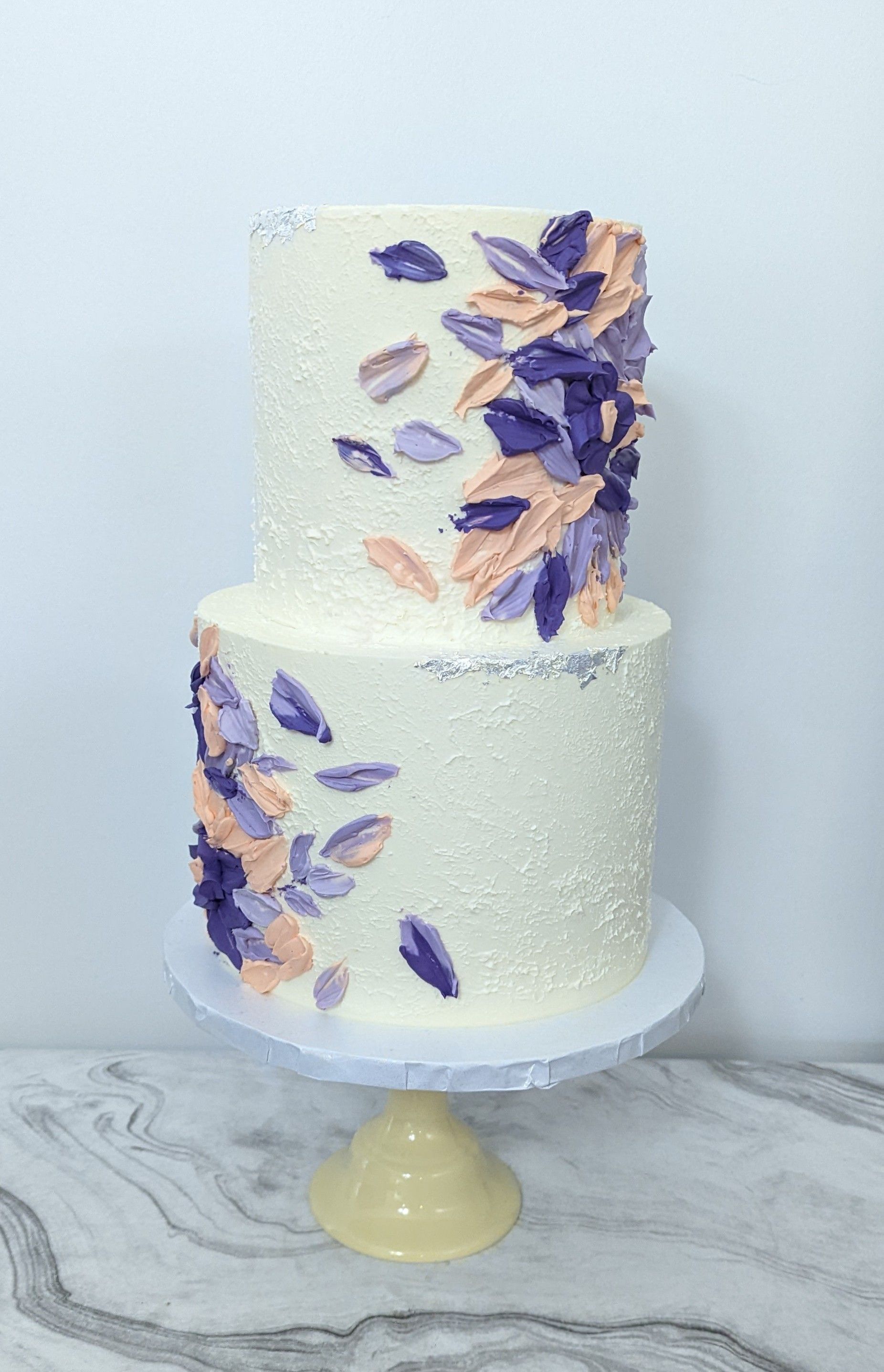 two tier textured cake with purple and pink textures