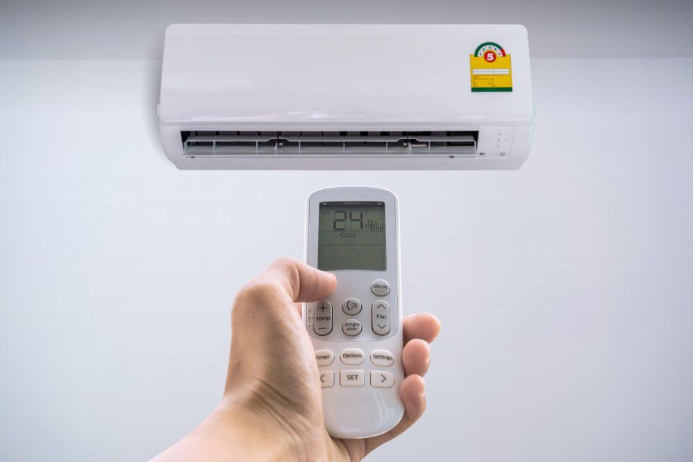 Air Conditioner with Remote Controller — Air Conditioning & Electrical Services in Hervey Bay, QLD