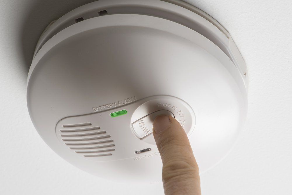 Installing Smoke Detector — Air Conditioning & Electrical Services in Hervey Bay, QLD