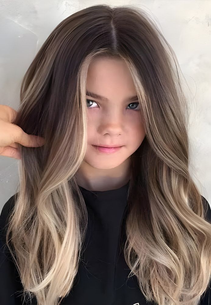 A Young Girl With Long Brown Hair and Blonde Highlights — L'Auranda Hair Salon In Evan St. Mackay, QLD