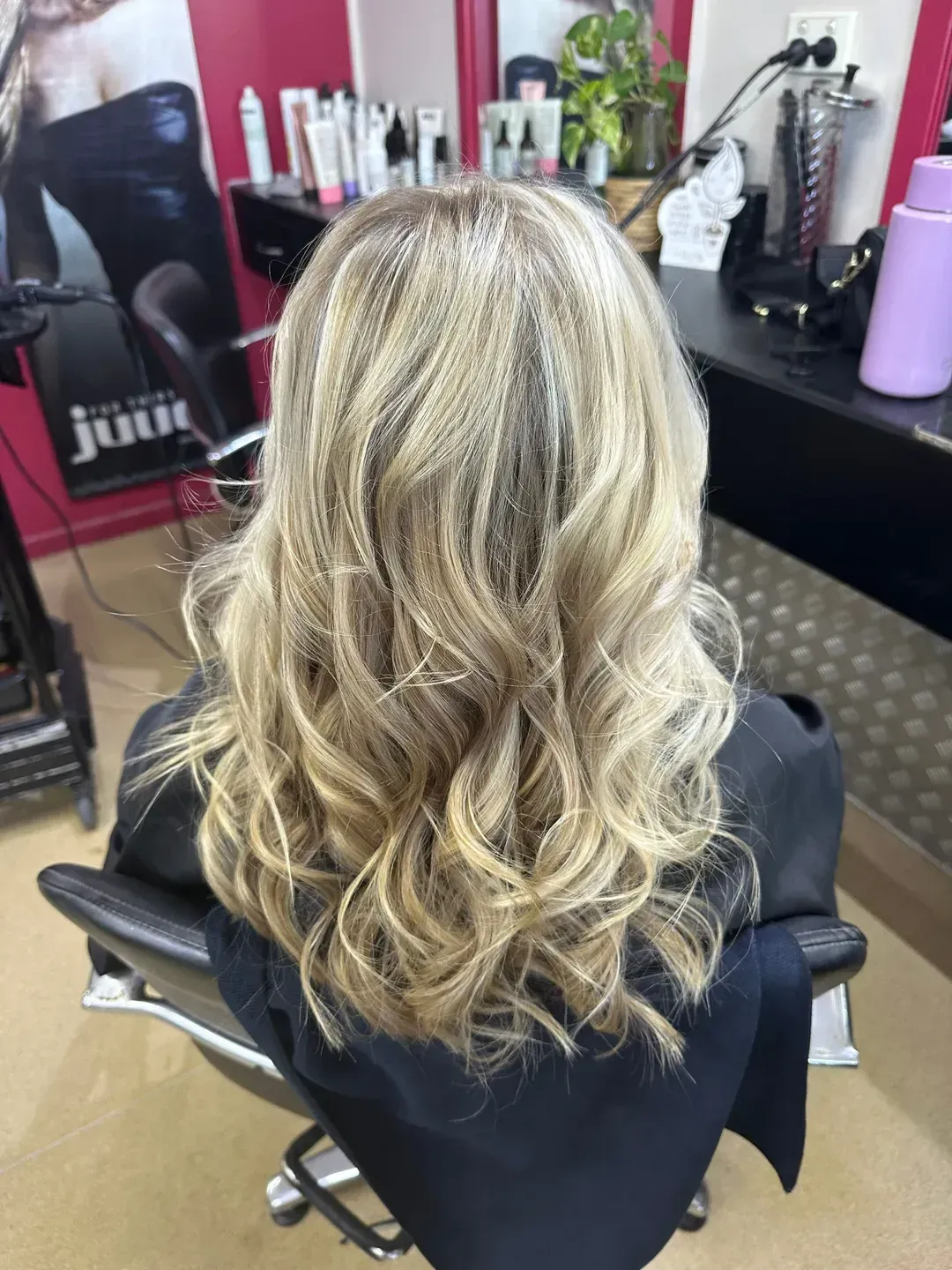 A Woman Has Had Her Hair Curled By A Hairdresser In A Salon —  L'Auranda Hair Salon In Evan St. Mackay, QLD