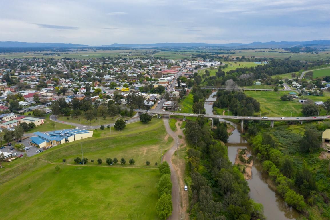 An Aerial View of a Small Town Surrounded by Trees and a River — Trade & General Towing in Singleton, NSW
