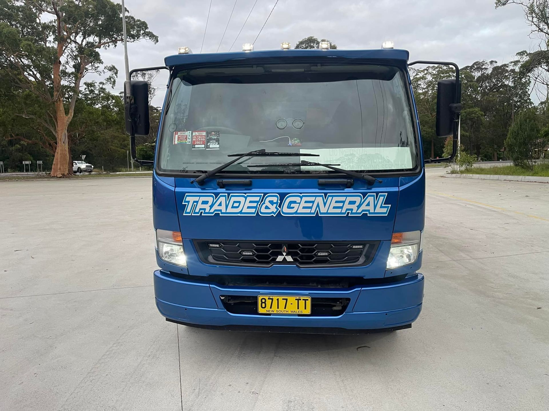 A Blue Trade & General Truck Is Parked In A Parking Lot — Trade & General Towing In Sandgate, NSW