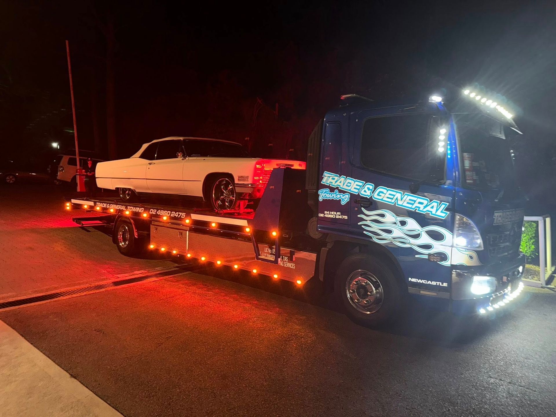 A Truck Doing Roadside Assistance During Night