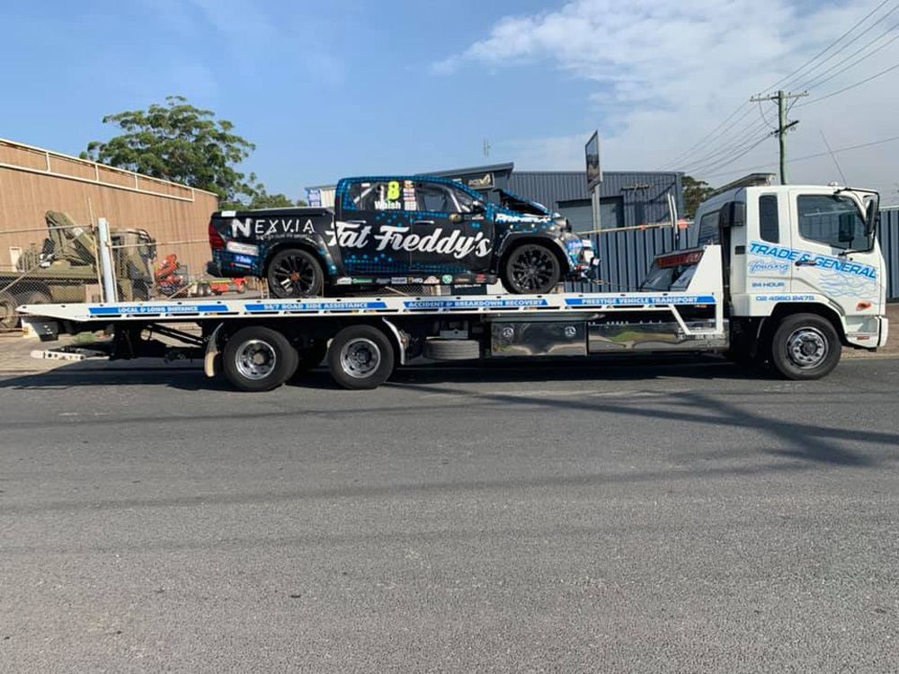 Towing Racing Pickup Truck — Trade & General Towing in Sandgate, NSW