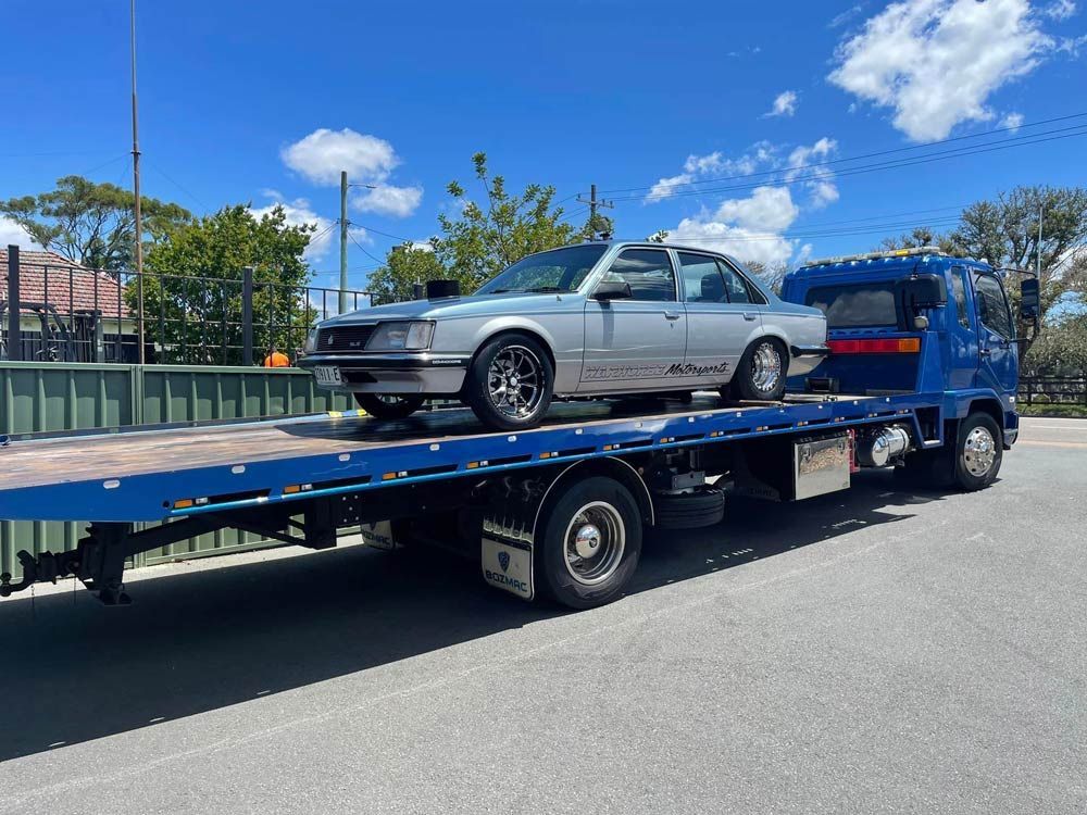 Holden Commodore Towed Car — Trade & General Towing in Sandgate, NSW