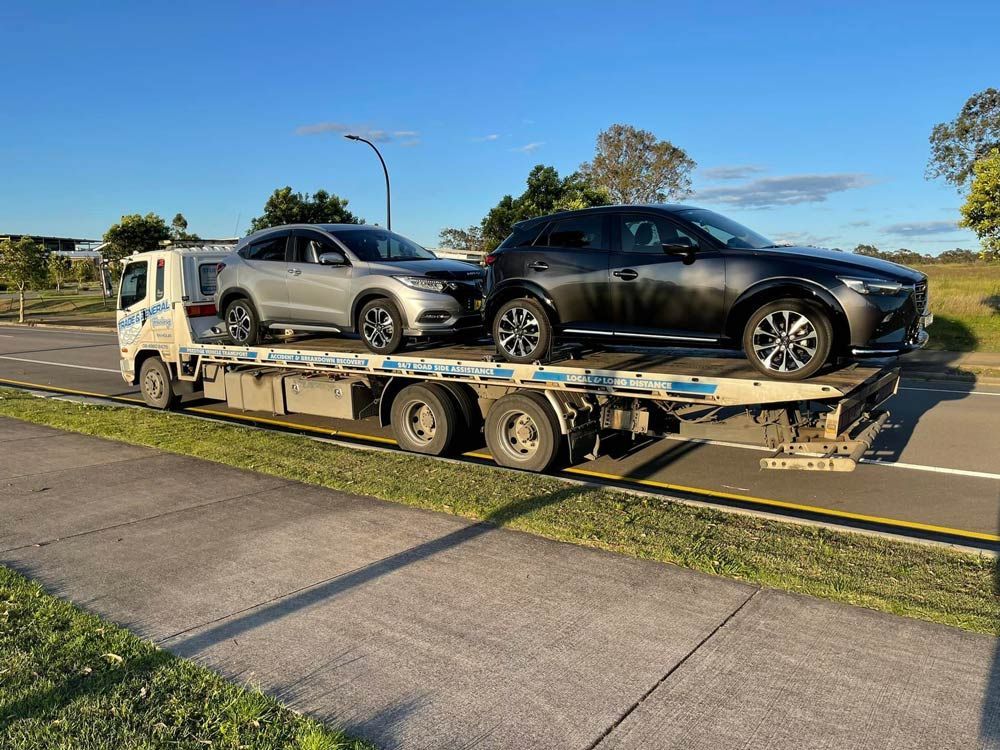 Honda Hr-v and Black Mazda Suv Towed — Trade & General Towing in Warners Bay, NSW